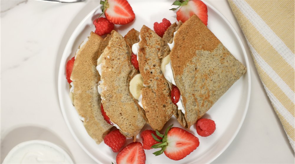 Sol Food crepes filled with cream, banana and strawberries